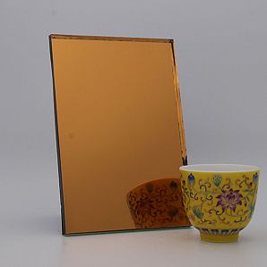 مرآة زجاجية برتقالية ذهبية